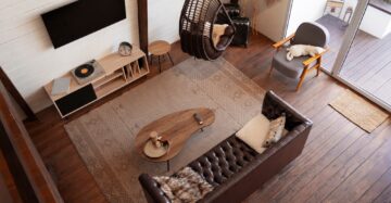 A seamless fusion of color, texture, and lighting showcases the ultimate goal of zoning - a spacious living room transformed into a multifaceted retreat, where every corner tells its own story and serves its unique purpose.